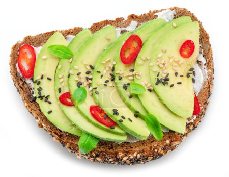Photo for Avocado toast - bread with avocado slices, pieces of chilli pepper and black sesame isolated on white background. Top view. - Royalty Free Image
