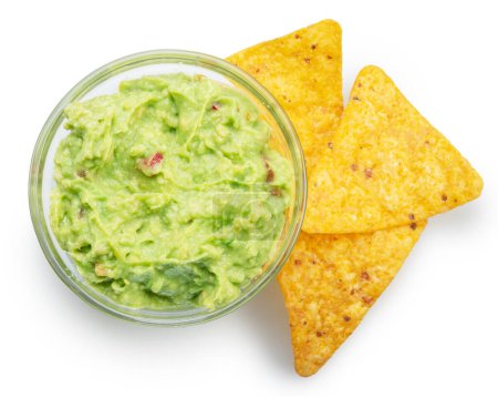 Photo for Guacamole bowl and corn chips near it on white background. Top view. File contains clipping path. - Royalty Free Image