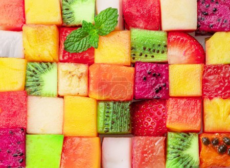 Photo for Fruit puzzle. Colorful food background or pattern arranged of different fruit cubes. Dietary concept. - Royalty Free Image