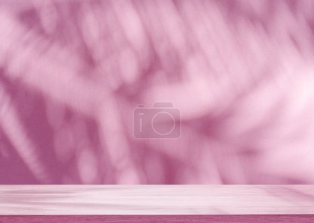 Foto de Sombra borrosa de hojas de palma tropical en la pared rosa y mesa en primer plano. Concepto de verano. - Imagen libre de derechos