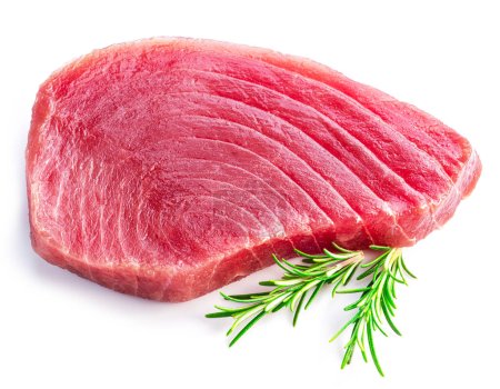 Foto de Fresh tuna steak nad rosemary twig isolated on white background. - Imagen libre de derechos