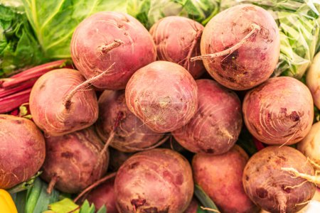 Photo for Bunch of fresh red beetroots in the farm market stall. - Royalty Free Image