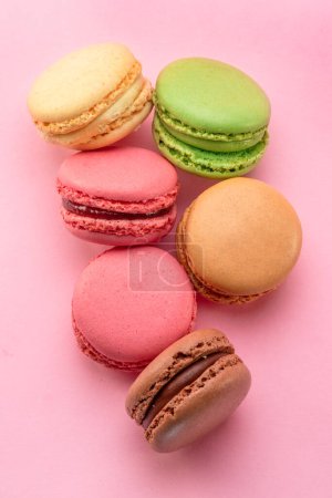 Photo for Colorful french macarons isolated on pink background. Top view. - Royalty Free Image