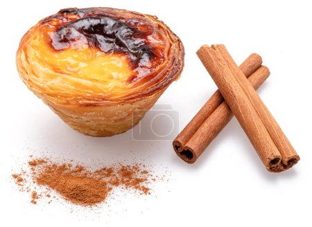 Photo for Pastel de nata tart and cinnamon sticks isolated on white background. - Royalty Free Image