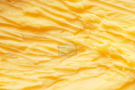 Téléchargez les photos : Surface de beurre ondulé fondu doux. Macro shot. - en image libre de droit