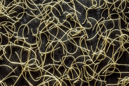 Photo for Italian pasta vermicelli close-up on black background. Food background. - Royalty Free Image