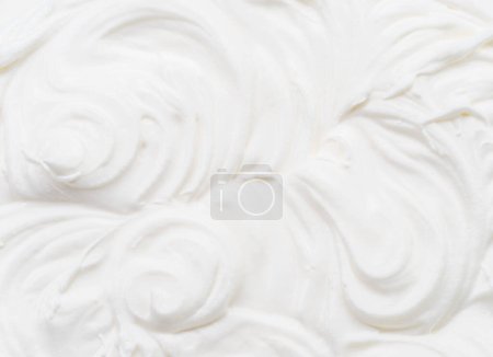 Photo for Creamy waves and swirls in yoghurt or cream surface. Top view. - Royalty Free Image