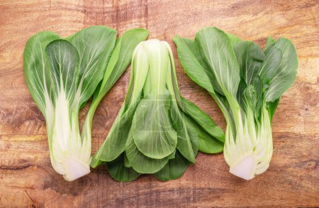 Photo for Bok choy or chinese cabbage on wooden background. View above. - Royalty Free Image