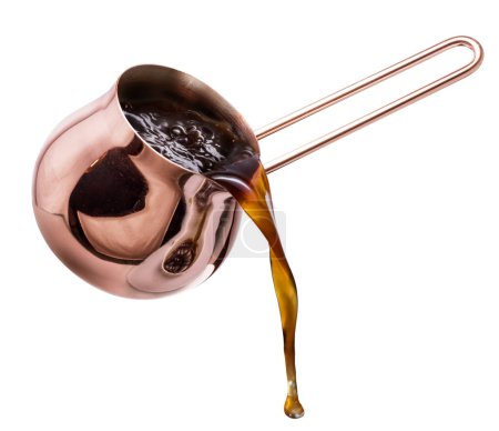Boiling coffee drink pouring from copper coffee cezve on white background. File contains clipping path.