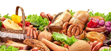Photo for Varied assortment of prepared meats and sausages with vegetables and herbs. Wonderful food background for your projects. Clipping path. - Royalty Free Image