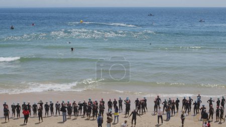 Photo for Portugal, Oeiras, Lisbon 05.05.2024. Sprint triathlon individual national championship: swimming, cycling and running. Ocean swim stage. - Royalty Free Image