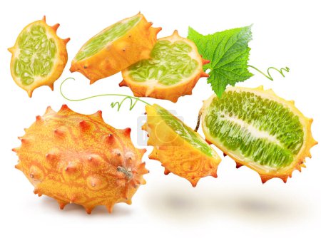 Kiwano fruit with kiwano slices levitating in air on white background. 