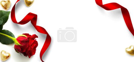 Foto de Banner Design elements for Valentine's Day background. Red rose flower, Heart shaped golden candies and Red ribbon on a white background, flat lay - Imagen libre de derechos