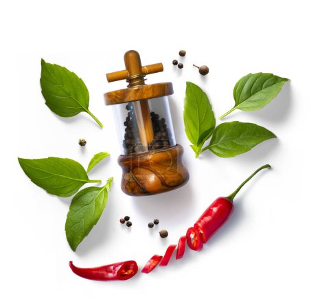 Photo for Traditional italian pepper shaker, red chilli pepper and green organic basil leaves on white background.  Ingredient, spice for cooking. collection for culinary design - Royalty Free Image