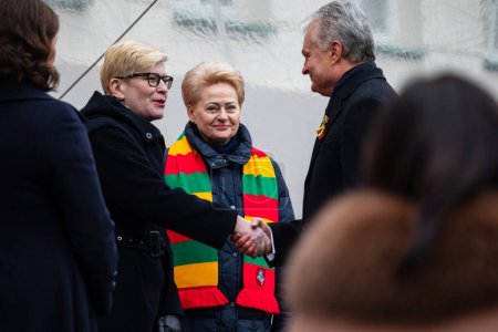 Photo for Vilnius, Lithuania - February 16, 2023: President Gitanas Nauseda, prime minister Ingrida Simonyte, former president Dalia Grybauskaite during the State Restoration Day of Lithuania. - Royalty Free Image