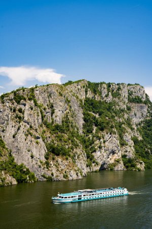 Photo for Danube, Serbia - July 1, 2022: Der kleine Prinz (The Little Prince) river cruise ship in Danube Gorge in Serbia. Ship was built in 1990s, accomodate 90 passengers and sailing under the flag of Germany. - Royalty Free Image