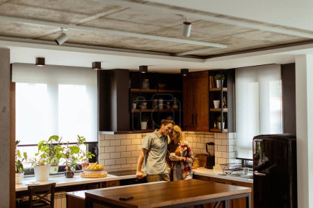 Heartwarming scene unfolds in a domestic kitchen as a couple shares an affectionate embrace, surrounded by the tranquility of their home at the end of the day