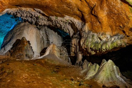 Stalactites and stalagmites dominate the scene in the dimly lit caverns of Lazar's Cave in Serbia