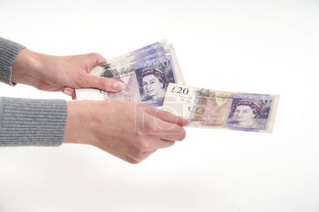 Closeup woman hands counting UK pounds. Concept Finance Business Investment Success
