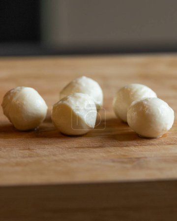mozzarella balls close-up on wooden board