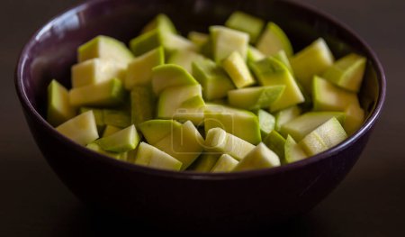 chopped zucchini in bowl close-up