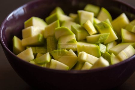chopped zucchini in bowl close-up