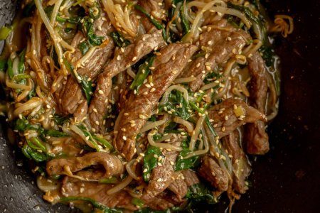 delicious Korean dish: veal in a wok close-up