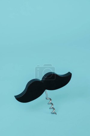 black moustache topping a corkscrew, on a blue background with some blank space on top