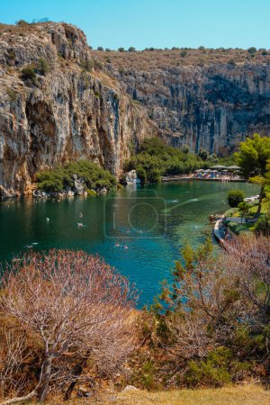 Photo for Vouliagmeni, Greece - September 1, 2022: A view of the famous Lake Vouliagmeni in Vouliagmeni, Greece, in a summer day - Royalty Free Image