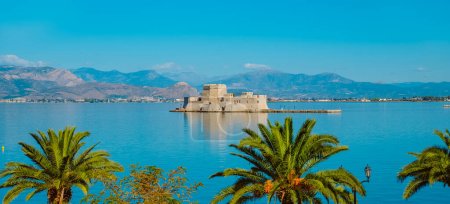 Photo for A view of the Bourtzi castle in Nafplio, in the Aegean sea, in Greece, in a panoramic format to use as web banner or header - Royalty Free Image
