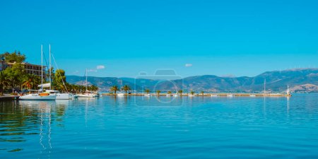 Photo for A view of the port of Nafplio, in the Aegean sea, in Greece, on a summer day, in a panoramic format to use as web banner or header - Royalty Free Image