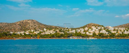 Photo for A panoramic view of the Vouliagmeni beach, in Vouliagmeni, Greece, on a summer day - Royalty Free Image