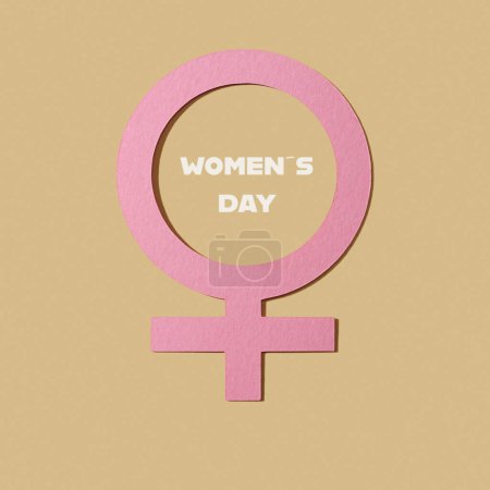 Photo for A pink female gender symbol and the text womens day on a pale brown background - Royalty Free Image