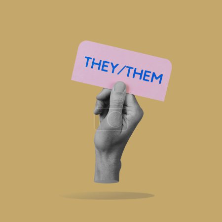 Photo for A hand, in black and white, holds a pink sign with the pronouns they, them written in blue, against a brown background - Royalty Free Image