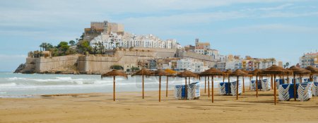 Photo for A view of Norte beach in Peniscola, Spain, with the old town and its castle in the background, in a panoramic format to use as web banner or header - Royalty Free Image