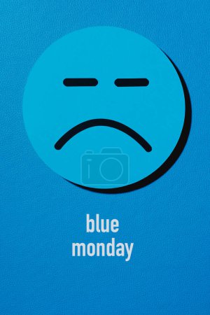 Photo for A sad face and the text blue monday on a blue background - Royalty Free Image