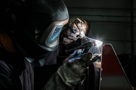 welder at work in a workshop, France