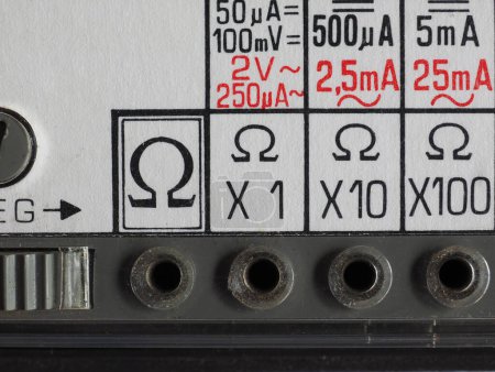 Photo for Electrical symbols on a vintage analog multimeter measuring instrument - Royalty Free Image