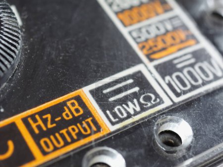 Photo for Electrical symbols on a vintage analog multimeter measuring instrument - Royalty Free Image
