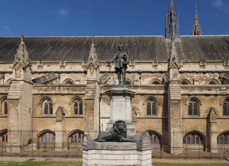 Statue of Oliver Cromwell in front of the Houses of Parliament by sculptor Hamo Thornycroft circa 1899 in London, UK