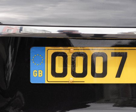 british car plate, only partial number shown for privacy
