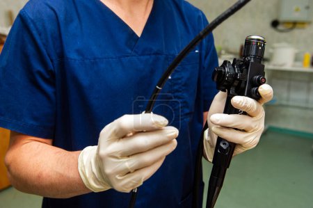 Endoscope in the hands of doctor. Medical instruments used in gastroscopy.