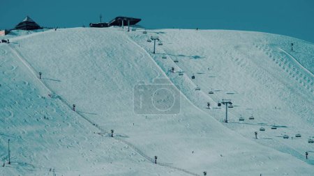 Beautiful Alpine skiing slope and ski lift
