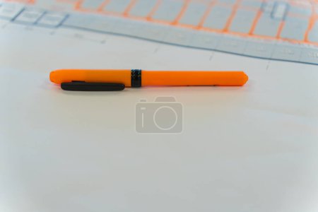Photo for Orange Marker Highlighter used to markup Plans - Royalty Free Image