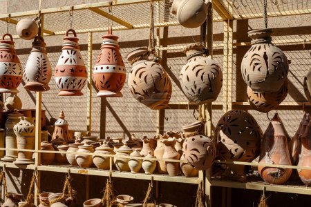 Photo for Hand Made Pottery in Nizwa Market. Clay Jars at the Rural Traditional Arabic Bazaar, Oman. - Royalty Free Image