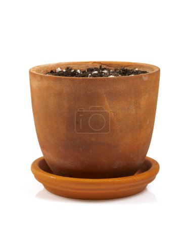 Photo for An old ceramic pot with soil waiting for plant to be planted, isolated on white backrgound. - Royalty Free Image
