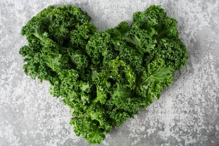 Photo for Heart made of kale cabbage on grey stone surface - Royalty Free Image