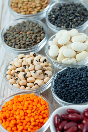 Photo for Lentils, legumes and beans on white surface - Royalty Free Image