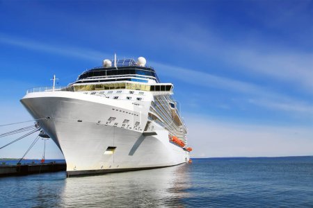 Photo for Luxury cruise ship in port on sunny day - Royalty Free Image