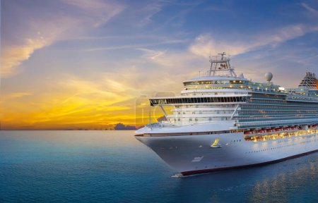 Photo for Luxury cruise ship sailing to port on sunrise - Royalty Free Image